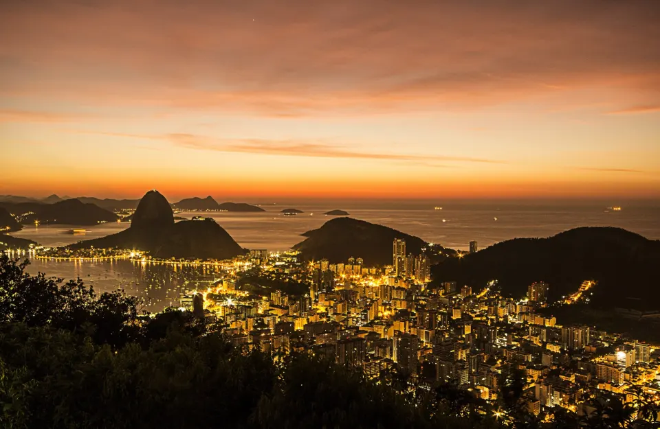 Dawn sky over Guanabara Bay, Sugarloaf and the city lights of Botafogo
