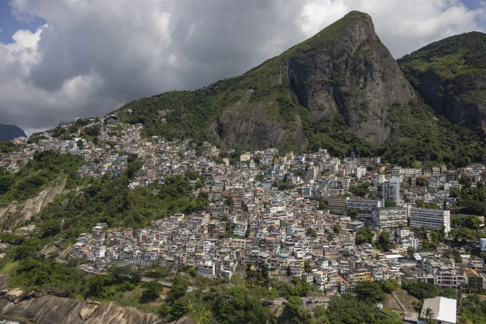 Hillside houses of Vidigal favela climbing toward the Dois Irmãos peaks in Rio de Janeiro