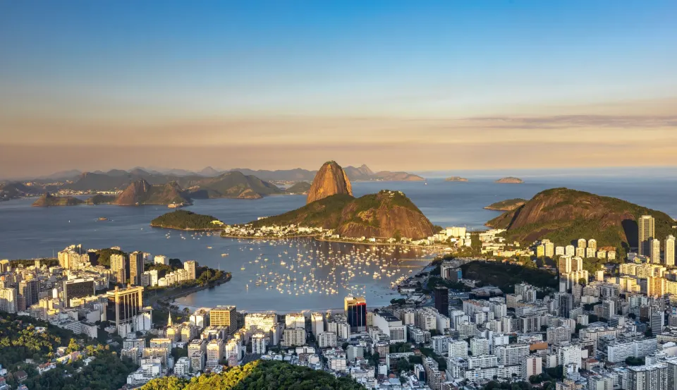 Golden-hour view from Mirante Dona Marta over Botafogo Bay and Sugarloaf Mountain