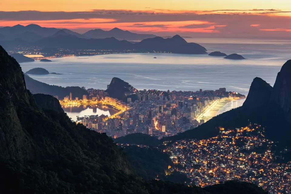 Dawn view of Ipanema, Lagoa and the lights of Rocinha from the Tijuca mountains